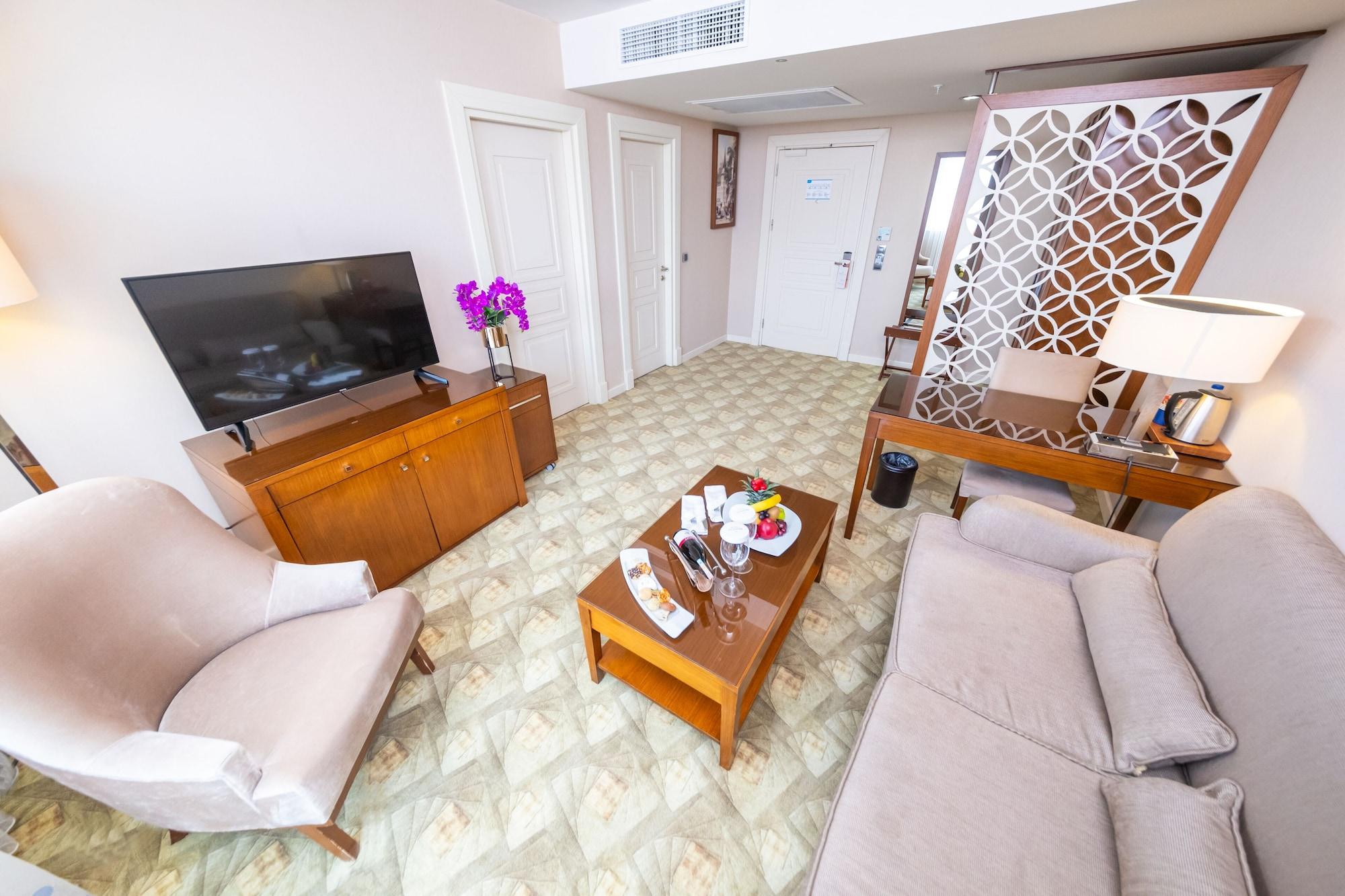 Miracle Istanbul Asia Airport Hotel & Spa Exterior photo A living room in a suite at the hotel
